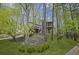 View of the home exterior surrounded by lush trees and greenery at 1670 Nordic Trce, Marietta, GA 30068