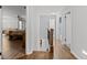 Upstairs hallway with hardwood flooring leading to a bedroom with ceiling fan at 1670 Nordic Trce, Marietta, GA 30068