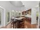 Bright kitchen with granite countertops, dark wood cabinets, and a breakfast bar at 1670 Nordic Trce, Marietta, GA 30068