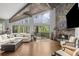 Spacious living room with a stone fireplace, wood beams, and large windows offering nature views at 1670 Nordic Trce, Marietta, GA 30068