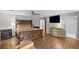 Large primary bedroom featuring hardwood floors, stylish furnishings, and a television at 1670 Nordic Trce, Marietta, GA 30068