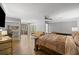 Spacious primary bedroom with hardwood floors, ceiling fan, and sitting area at 1670 Nordic Trce, Marietta, GA 30068
