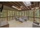 Relaxing screened porch with comfortable seating and wooded views at 1670 Nordic Trce, Marietta, GA 30068