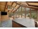 Inviting sunroom with wood paneling, many windows and a hot tub at 1670 Nordic Trce, Marietta, GA 30068