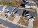 Aerial view of homes with well-maintained yards and long driveways on a sunny day at 127 Crest Brooke Dr, Canton, GA 30115