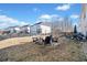 Spacious backyard featuring a fire pit, seating and landscaped surroundings at 127 Crest Brooke Dr, Canton, GA 30115