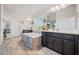 Bright bathroom with double vanities, soaking tub with stone surround, and tiled floors at 127 Crest Brooke Dr, Canton, GA 30115