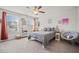 Inviting bedroom with natural light, cozy seating, and a serene atmosphere at 127 Crest Brooke Dr, Canton, GA 30115