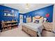 Charming bedroom with a playful theme, wooden furniture, and bright natural light at 127 Crest Brooke Dr, Canton, GA 30115
