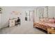 Bright bedroom with a desk, cozy bed, and decorative wall art at 127 Crest Brooke Dr, Canton, GA 30115