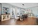 Dining room with a long wooden table, stylish chairs, and decorative cabinets at 127 Crest Brooke Dr, Canton, GA 30115