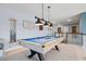 Well-lit game room upstairs with a pool table, and plenty of room for activities and entertainment at 127 Crest Brooke Dr, Canton, GA 30115