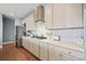 Modern kitchen with stainless steel appliances, white cabinets, and quartz countertops at 127 Crest Brooke Dr, Canton, GA 30115