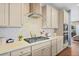 Modern kitchen featuring stainless steel appliances, decorative backsplash, and light countertops at 127 Crest Brooke Dr, Canton, GA 30115