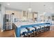 Spacious kitchen showcasing stainless steel appliances, a large island with barstool seating, and pendant lighting at 127 Crest Brooke Dr, Canton, GA 30115