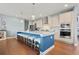 Bright kitchen with a large island, pendant lighting, and a full suite of appliances at 127 Crest Brooke Dr, Canton, GA 30115