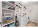Organized laundry room with modern appliances, built-in shelving and ample storage space at 127 Crest Brooke Dr, Canton, GA 30115