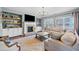 Inviting living room with a brick fireplace, built-in shelving, and comfortable seating at 127 Crest Brooke Dr, Canton, GA 30115