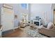 Bright living room with high ceilings, fireplace, and hardwood floors at 127 Crest Brooke Dr, Canton, GA 30115