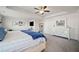 Large main bedroom with sitting area, ceiling fan, and ample storage space at 127 Crest Brooke Dr, Canton, GA 30115