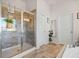 Tiled shower with glass door and modern fixtures in the primary bathroom at 127 Crest Brooke Dr, Canton, GA 30115