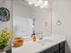 Bathroom vanity featuring white countertops, dark wood cabinetry, and modern fixtures at 127 Crest Brooke Dr, Canton, GA 30115