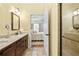 Bathroom featuring double vanity, walk-in glass shower and ensuite access to bedroom at 1478 Settlers Walk Sw Way, Marietta, GA 30060