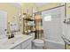 Bright bathroom features a shower-tub combination with white subway tile and decorative shelving at 1478 Settlers Walk Sw Way, Marietta, GA 30060