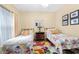 Cozy bedroom featuring two twin beds, floral bedding, and a bright, colorful accent rug at 1478 Settlers Walk Sw Way, Marietta, GA 30060