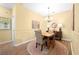 Cozy dining area with a wooden table, four chairs, and elegant lighting fixtures at 1478 Settlers Walk Sw Way, Marietta, GA 30060