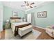 Main bedroom with tray ceilings and neutral color palette with an ensuite bathroom at 1478 Settlers Walk Sw Way, Marietta, GA 30060