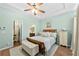 Main bedroom with tray ceilings and neutral color palette with an ensuite bathroom at 1478 Settlers Walk Sw Way, Marietta, GA 30060