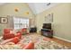 Bright sitting room with comfortable seating, a vaulted ceiling and an entertainment center at 1478 Settlers Walk Sw Way, Marietta, GA 30060
