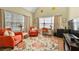 Bright sitting room with comfortable seating, large windows, and a cozy workspace at 1478 Settlers Walk Sw Way, Marietta, GA 30060