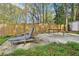 Spacious backyard includes lounge chairs and a table on a concrete patio at 2407 Ridgeway Dr, Doraville, GA 30360