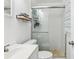 Bathroom featuring a tiled shower with glass doors, sink, and fixtures at 2407 Ridgeway Dr, Doraville, GA 30360