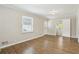Bright bedroom with hardwood floors, neutral walls, and ample natural light from the window at 2407 Ridgeway Dr, Doraville, GA 30360