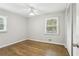 Bedroom boasts hardwood floors, natural light, and a closet for ample storage at 2407 Ridgeway Dr, Doraville, GA 30360