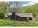 View of the house exterior featuring a chimney and carport at 2407 Ridgeway Dr, Doraville, GA 30360