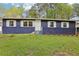 Inviting single-story home with painted brick and white trim, set on a well-maintained lawn at 2407 Ridgeway Dr, Doraville, GA 30360