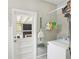 A well-lit laundry room with a door to the backyard and a washer and dryer at 2407 Ridgeway Dr, Doraville, GA 30360