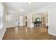 Spacious living room with hardwood floors and open access to other rooms in the house at 2407 Ridgeway Dr, Doraville, GA 30360