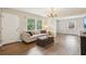 Cozy living room with hardwood floors, neutral color scheme, and large windows at 2407 Ridgeway Dr, Doraville, GA 30360