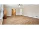Large living room with vinyl floors, ceiling fan, and view to kitchen at 2407 Ridgeway Dr, Doraville, GA 30360