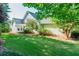 Backyard view with mature trees and lush greenery on a sunny day at 250 Blackberry Ln, Douglasville, GA 30134