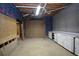 Unfinished basement with carpeting, cabinetry, and exposed structure at 250 Blackberry Ln, Douglasville, GA 30134