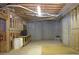 Unfinished basement with concrete walls, exposed structure and shelving at 250 Blackberry Ln, Douglasville, GA 30134