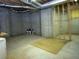 Unfinished basement with concrete walls, exposed structure and a large rug at 250 Blackberry Ln, Douglasville, GA 30134