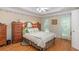 Charming bedroom with hardwood floors, floral wallpaper, and a cozy bed at 250 Blackberry Ln, Douglasville, GA 30134