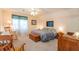 Bedroom with carpet, ceiling fan and featuring a bed, wood furniture, and natural light through the windows at 250 Blackberry Ln, Douglasville, GA 30134